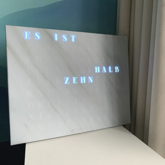 The look of Wordclock Jupiter White Marble Design