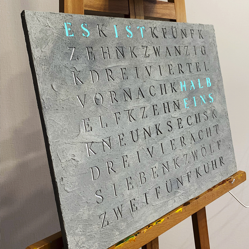 Wordclock Jupiter Concrete in interior